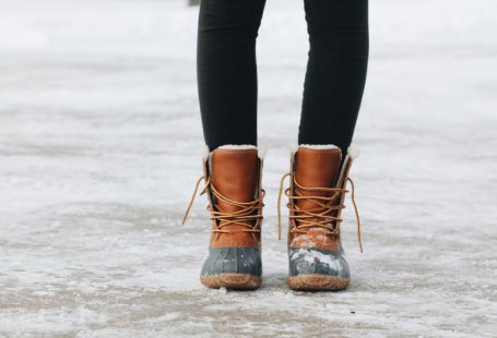 Snow Boots - person standing on brown ground
