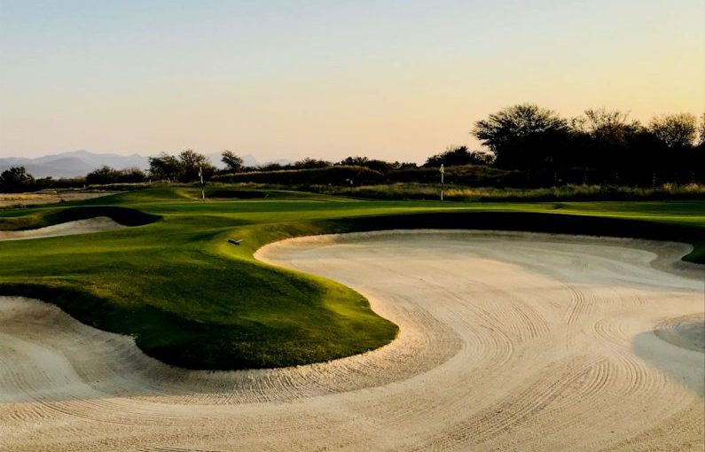 Golf Course - golf field under clear blue sky
