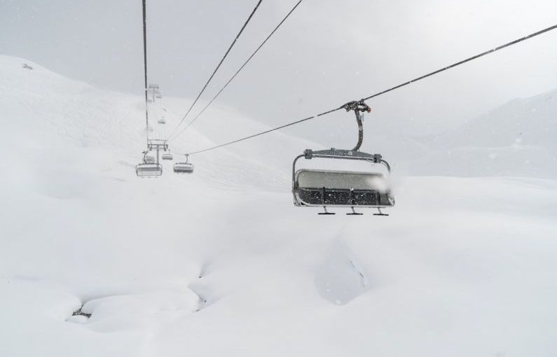 Ski Pass - black cable car during winter season
