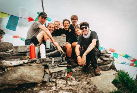 Group Photo - group picture of men and women on hill at daytime