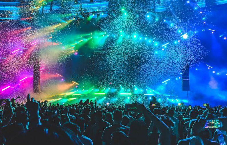 Festival Poster - group of people in front of stage