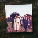 Historic Tour - a man and woman walking down a path with an umbrella