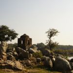 Heritage Site - a stone structure sitting on top of a lush green field
