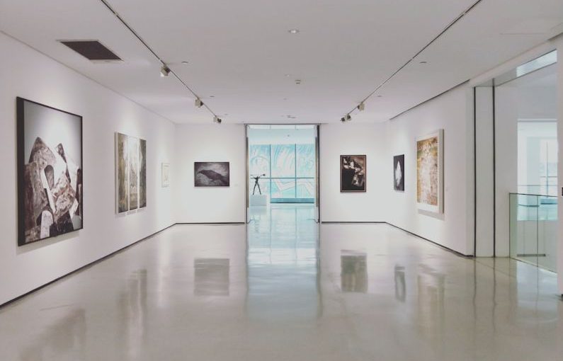 Art Gallery - assorted paintings on white painted wall