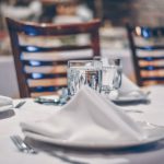 Budget Hotel - clear glass cup on table