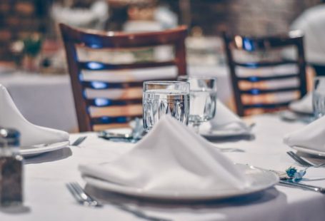 Budget Hotel - clear glass cup on table
