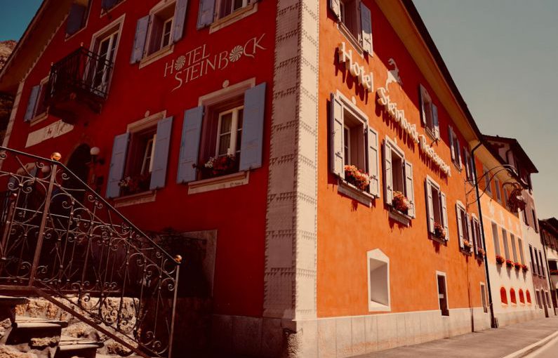 Romantic Hotel - red and white concrete building