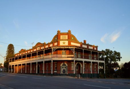 Historic Hotel - brown concrete building under blue sky during daytime