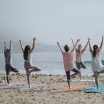 Wellness Retreat - five woman standing on seashore