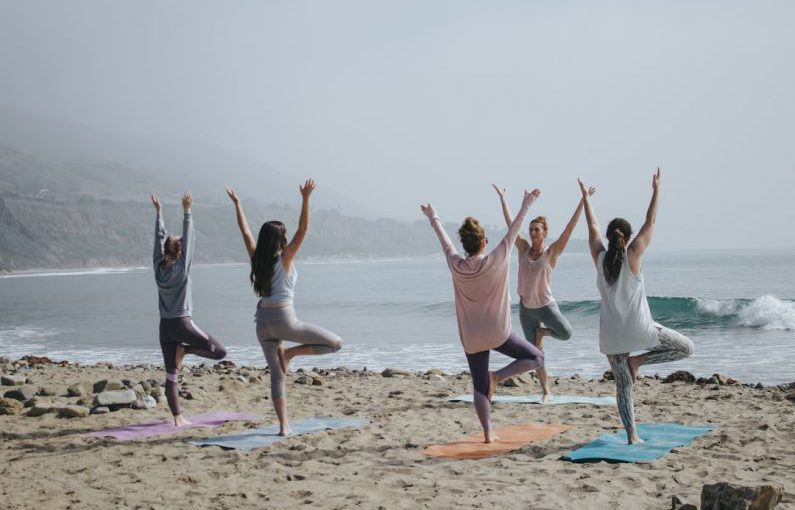Wellness Retreat - five woman standing on seashore