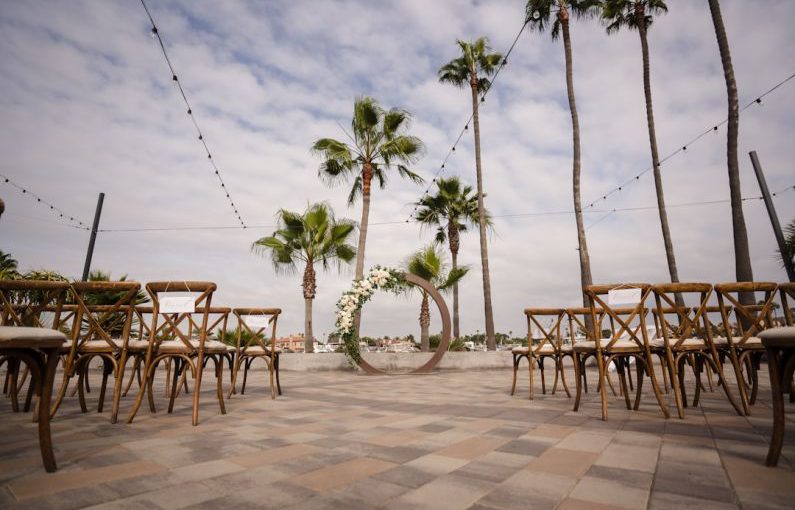 Award Hotel - brown wooden table and chairs on brown concrete floor