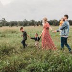 Family Fun - woman holding man and toddler hands during daytime