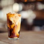 Coffee Café - glass cup filled with ice latte on tabletop