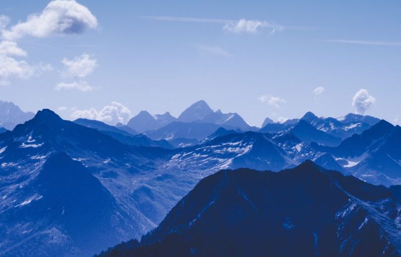 Altitude - mountain rage view under blue sky during daytime