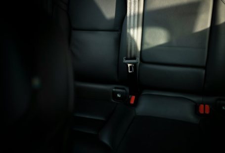 Safety Tips - black leather car seat with seat belt