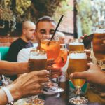 Drinking - people holding drinks during day