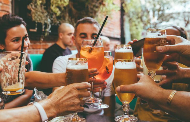Drinking - people holding drinks during day